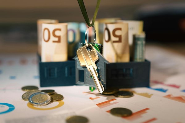 What is the origin and meaning of the cross pendant ?